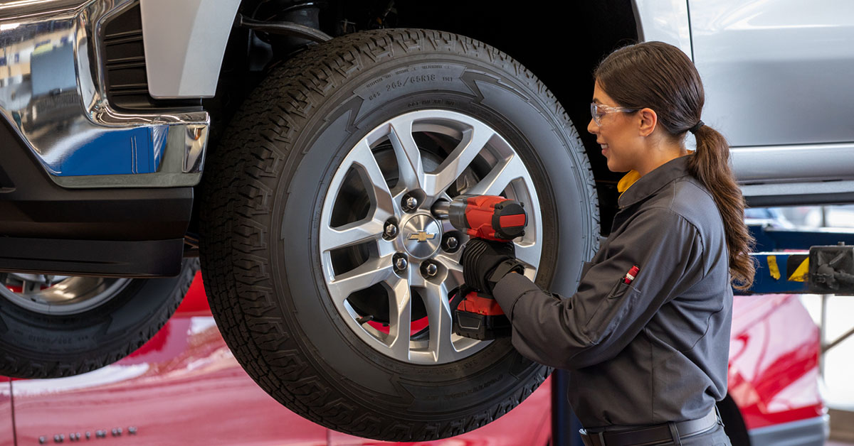 Mechanic working on a Chevrolet tire rotation schedule