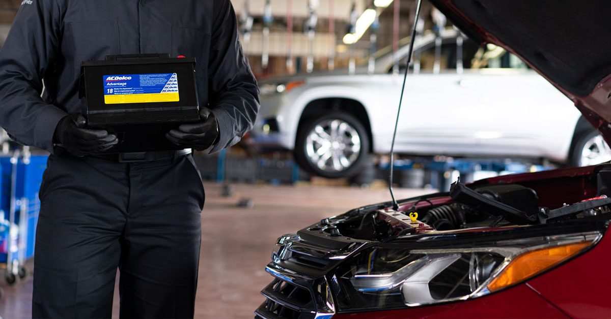 Technician performing Chevrolet battery service